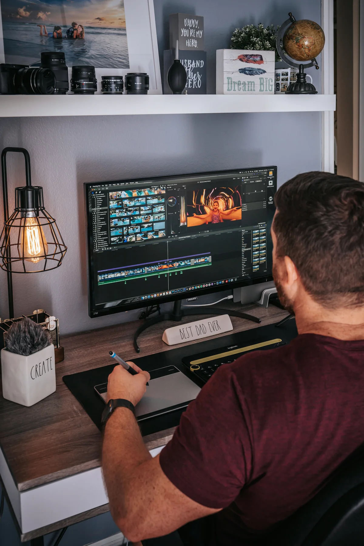 A video editor works on a timeline at his editing desk